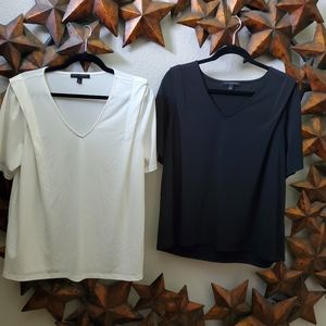 Two short sleeved women's blouses.